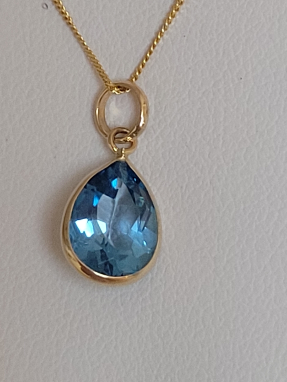 10k Solid Gold Teardrop Blue Topaz Pendant.
